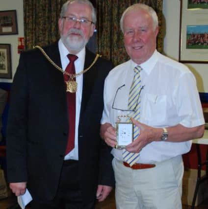 Derek Thompson receives his special award from Morpeth Mayor Andrew Tebbutt.