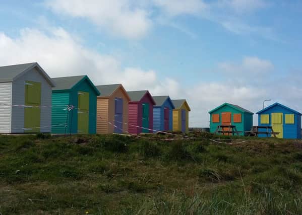 The new beach huts at Amble Little Shore.