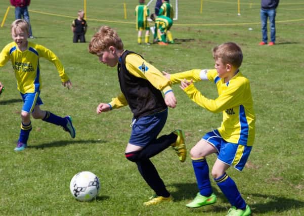 Action in the Tiny Woods Academy football tournament at Amble Welfare as part of the Amble Puffin Festival celebrations.
