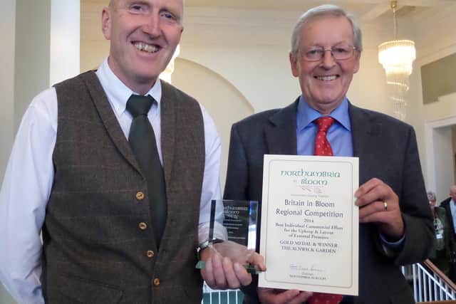 The Alnwick Garden head gardener Trevor Jones and Ian August receive a Northumbria In Bloom gold award in 2014.