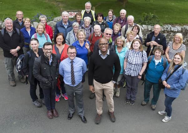 Front, Tony Gates, Northumberland National Park Authority chief executive with Professor Kevin Fenton, director of health and wellbeing at Public Health England, plus representatives from Active Northumberland and participants on the Walk to Wellbeing programme. Picture by Mark Savage