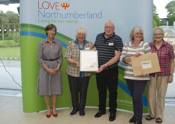 Harbottle Community Group are presented with their Love Northumberland award by the Duchess of Northumberland.