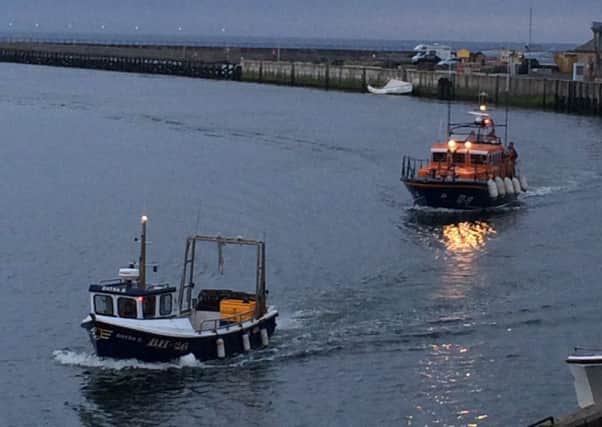 The all-weather lifeboat escorted the fishing vessel back to Amble