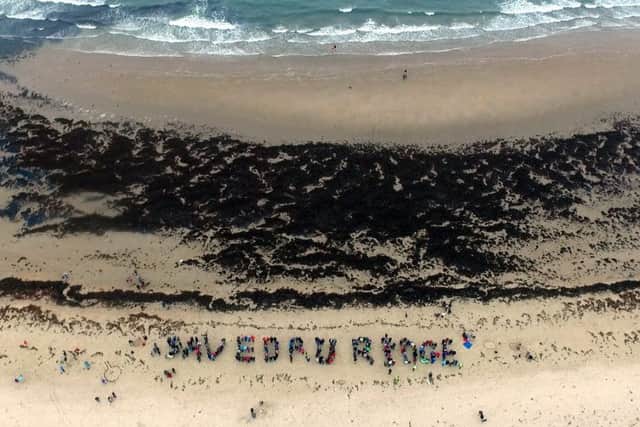 Protesters spell out Save Druridge at Druridge Bay.