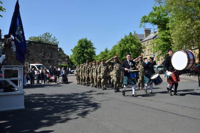 The troops arrive at Alnwick Castle, as Lord James Percy takes the salute.
