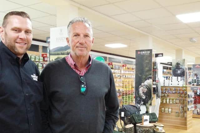 John Henderson, sales and marketing director for Pure Fishing, and Sir Ian Botham in the new-look shop in Alnwick.
