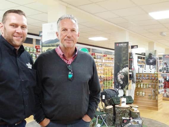 John Henderson, sales and marketing director for Pure Fishing, and Sir Ian Botham in the new-look shop in Alnwick.