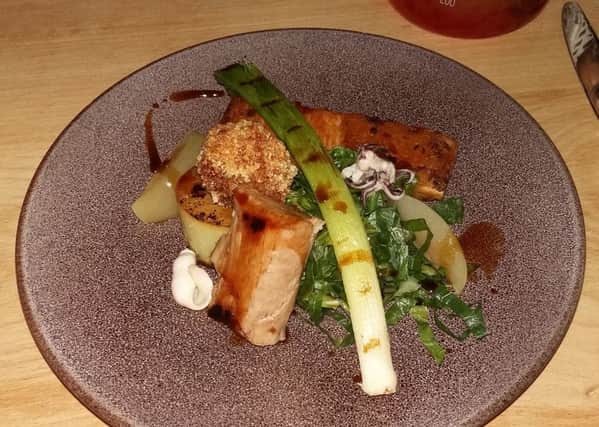 Slow-roasted belly pork, crispy pig cheek, lime and tarragon squid, sour pineapple, fondant potato and greens (Â£15.95).