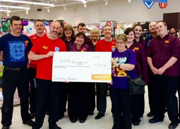 Colleagues at Sainsbury's Alnwick with Joan Austin, head of fund-raising at SHAK.