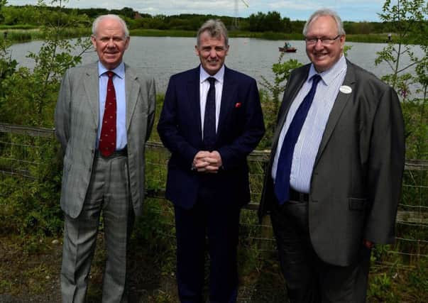 Proton Partners International chief executive, Mike Moran, centre, with Earth Balance chairman, Alan Rutherford, left, and Northumberland County Council leader, Grant Davey, at the launch event in July last year.