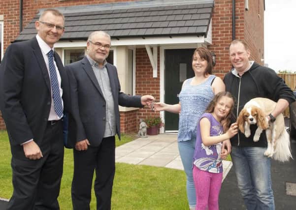 Northumberland County Councils head of housing, Phil Soderquest; Coun Allan Hepple, cabinet member for housing; Louise and Lee Stanfield with their daughter Megan.