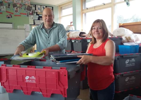 Duchess's Community High School headteacher Maurice Hall and assistant headteacher Diane Murphy pack equipment into boxes at the Howling Lane site.