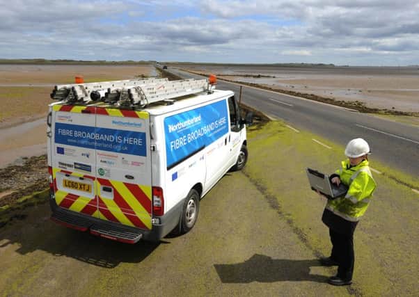 An Openreach engineer on the causeway to Lindisfarne as part of the iNorthumberland programme.