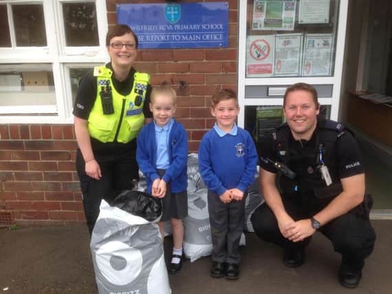 Children at St Wilfrid's RCVA Primary School in Blyth receive some of the compost from Blyth Neighbourhood Policing Team.