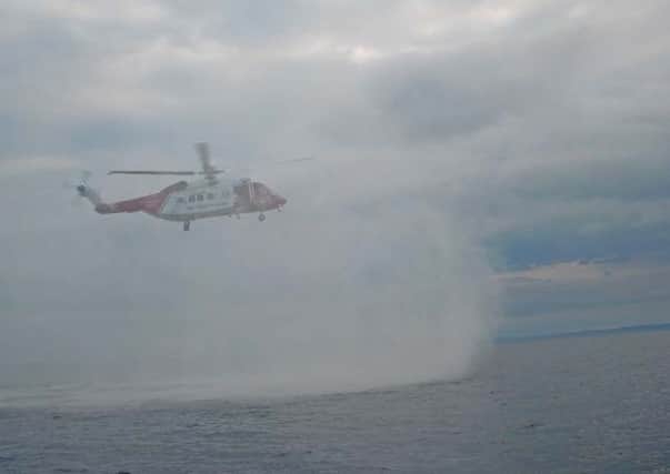 The Coastguard Rescue Helicopter from Inverness as it approached the lifeboat.