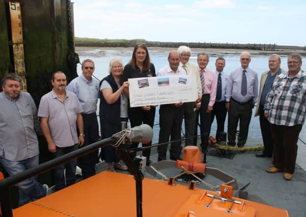 The cheque presentation towards Amble RNLI's Shannon Lifeboat Appeal. Picture by Bartle Rippon/The Ambler
