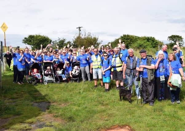 The Lindisfarne MND walk has raised more than Â£3,000.