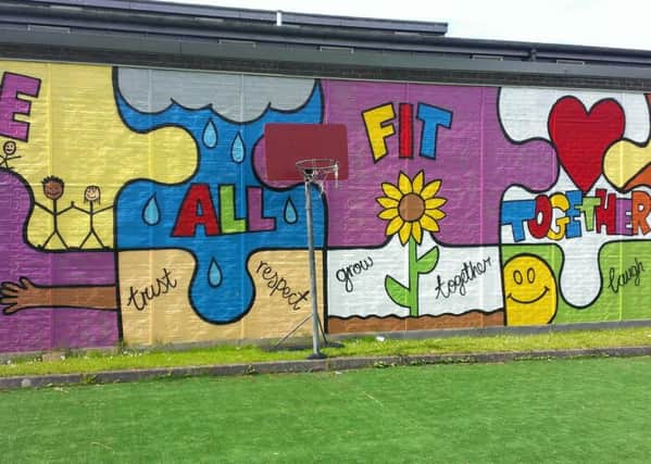 The recently painted mural in the garden area.