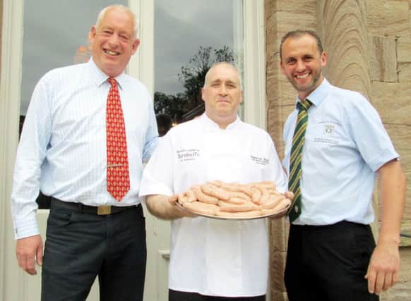 Lee Mavin, breakfast chef at Newton Hall, is pictured with a tray of The Newton Bangers, joined by general manager John Parker, left, and Turnbulls Mark Turnbull.