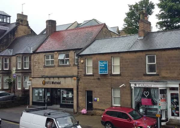 The probation office in Bondgate Without, Alnwick, with the for sale sign up.