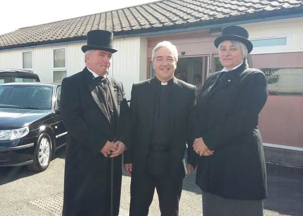 Alan Haile, Rev David Herbert and Sally-Ann Rogerson outside the new premises. Picture by James Willoughby