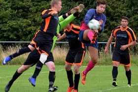 Amble Tavern's Brad McClelland challenges for the ball in his side's 3-1 win over Newsham Victory in the Blyth and Wansbeck Sunday League. Picture by Steve Miller