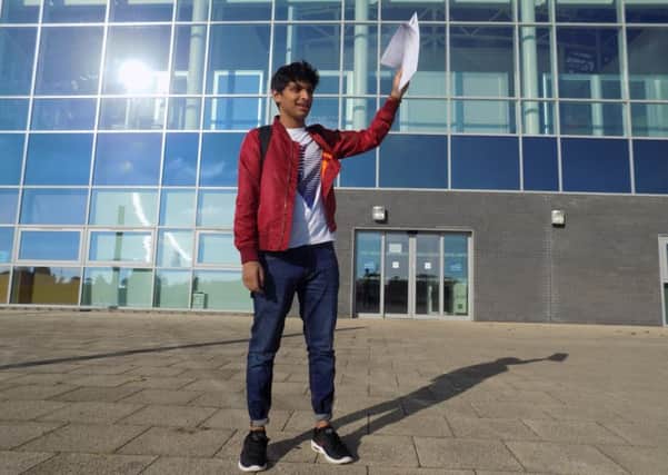 Tufayl Hannan from Monkseaton High School with his exam results.