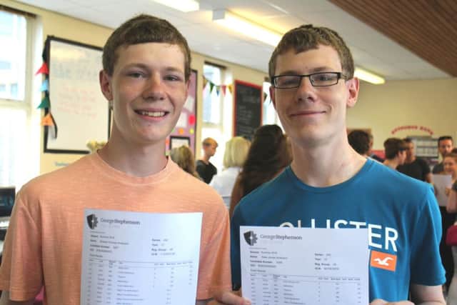 Twins Richard and Peter Anderson from George Stephenson High School celebrate their results.