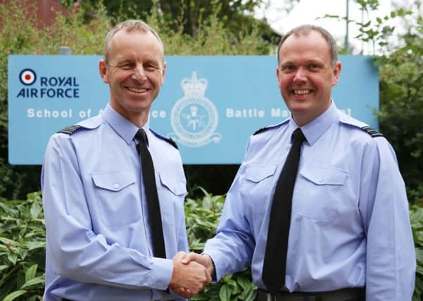 Wing Commander John Booth, right, hands over command of RAF Boulmers School of Aerospace Battle Management to Wing Commander Tim Brown.