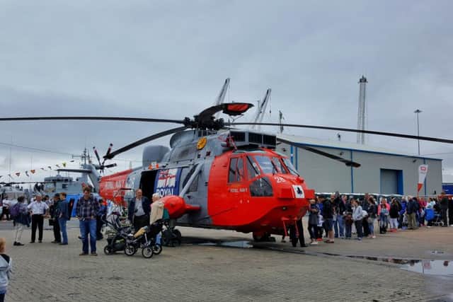 Away from the Tall Ships, queues grow to see the other attractions, including a Royal Navy rescue helicopter. Picture by LJ Sedgwick.