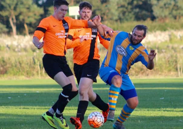 Action from the memorial match between Embleton WR (orange and black tops) and Craster Rovers, in honour of Christopher Penney. Picture by Andy Cowan Photos