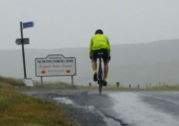 Mark Barr at the top of Black Hill during his fund-raising coast-to-coast cycle ride.