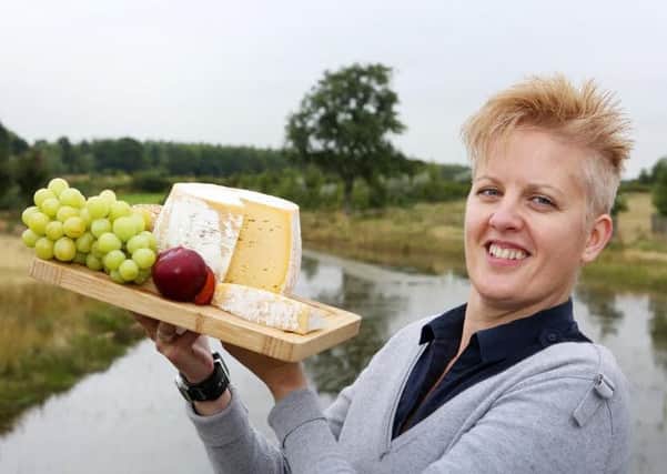 Alexis Moore, Kirkharle Courtyard manager, with the Capability Brown cheese. Picture by Helen Smith Photography