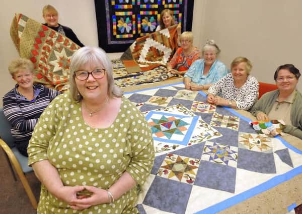 Sue Ross and her quilters