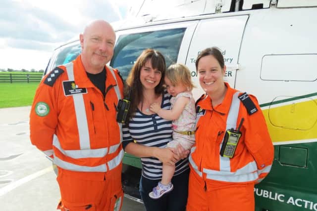 Paramedic Terry Sharpe, Rachel Hall with Scarlett and Dr Rachel Hawes.