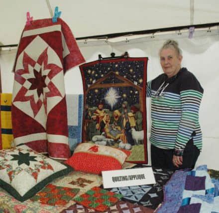 Carol Rothwell, from Rothbury Quilters, with some of her work. Picture by Mary Scott