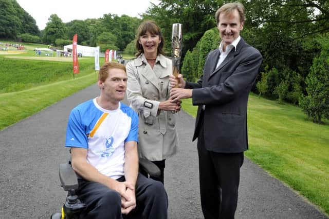 The Duke and Duchess of Northumberland with Stephen Miller during the Queen's Baton Relay in June 2014.