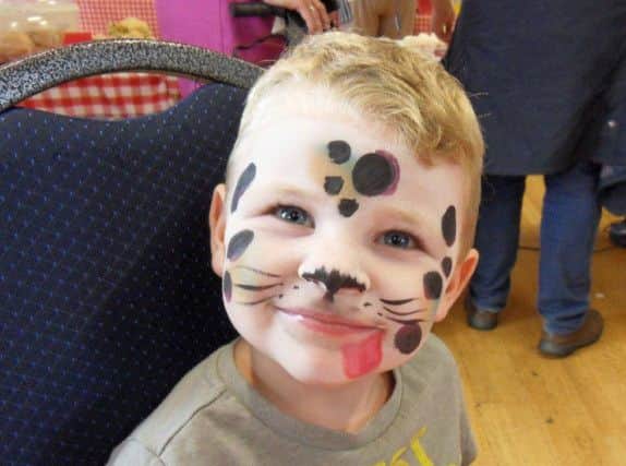 One of the youngsters to have their face painted by Sue Parker.