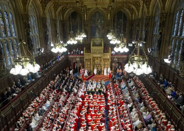 Queen Elizabeth II sits beside her husband, the Duke of Edinburgh,  delivers her speech during the State Opening of Parliament, in the House of Lords at the Palace of Westminster. Picture by Justin Tallis/PA Wire