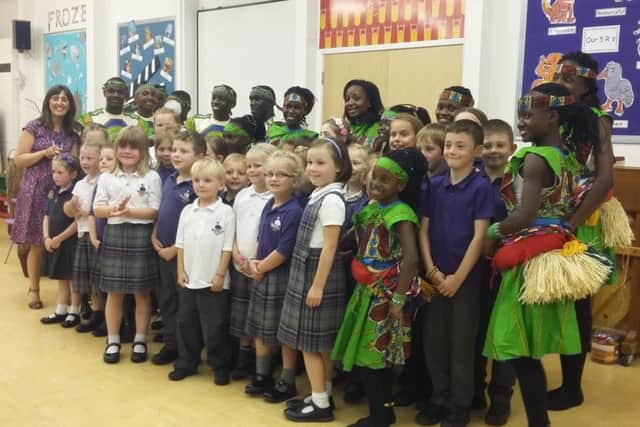 The Pearl of Africa Children's Choir and Swansfield Park First School's choir.