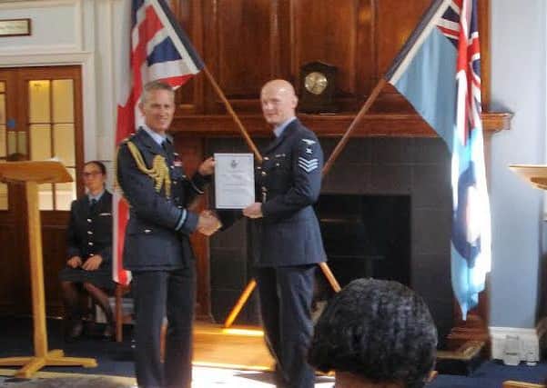 Carl Brown, from Wooler, receives the award of Chief of the Air Staffs Commendation on the Queens 90th Birthday Honours List.