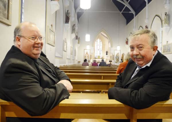 Parish priest Fr Peter Stott and Ken Wilson, chairman of the project team, inside the church. Picture by Jane Coltman.