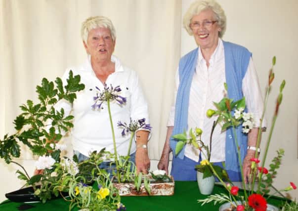 Janet Wilkinson of Bamburgh, left, described herself as an Ikebana enthusiast rather than an expert, really impressed Jean French, right, Wooler U3A Gardening Group members with demonstrations of three very different  styles of Ikebana.