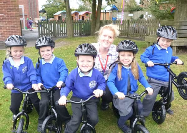 Pupils at Amble Links First School now have a set of five balance bikes and helmets.