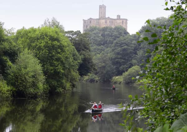 View of Warkworth castle and river.