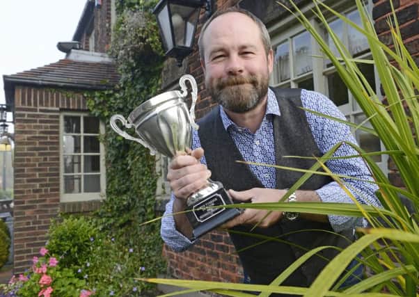 Sean Kelly from the Beehive Inn with his North Tyneside In Bloom award.  Picture by Jane Coltman