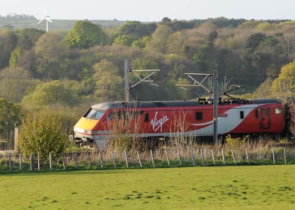 A Virgin Trains East Coast train on the East Coast mainline. Its services, as well as CrossCountry and Northern journeys, are being delayed.