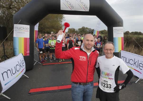 Phil Gray, managing director at Total Racing International, and Hugh Welch, senior partner at Muckle LPP, at the start of the Morpeth to Newcastle Marathon. Picture by Mike Smith.