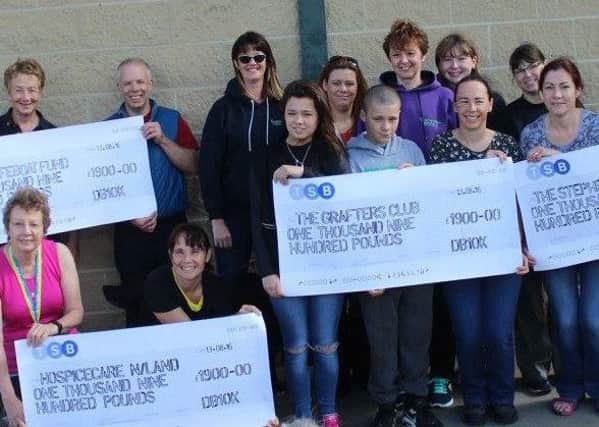 The four charities with their cheques from this year's Druridge Bay 10k.