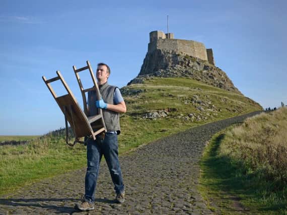 House steward Nick Lewis carries out one of the many items from Lindisfarne Castle in preparation for a programme of conservation work. Picture by Jane Coltman